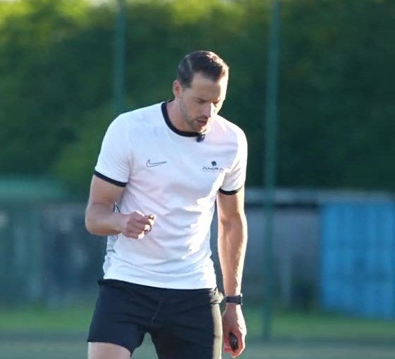Coach demonstrating with the ball